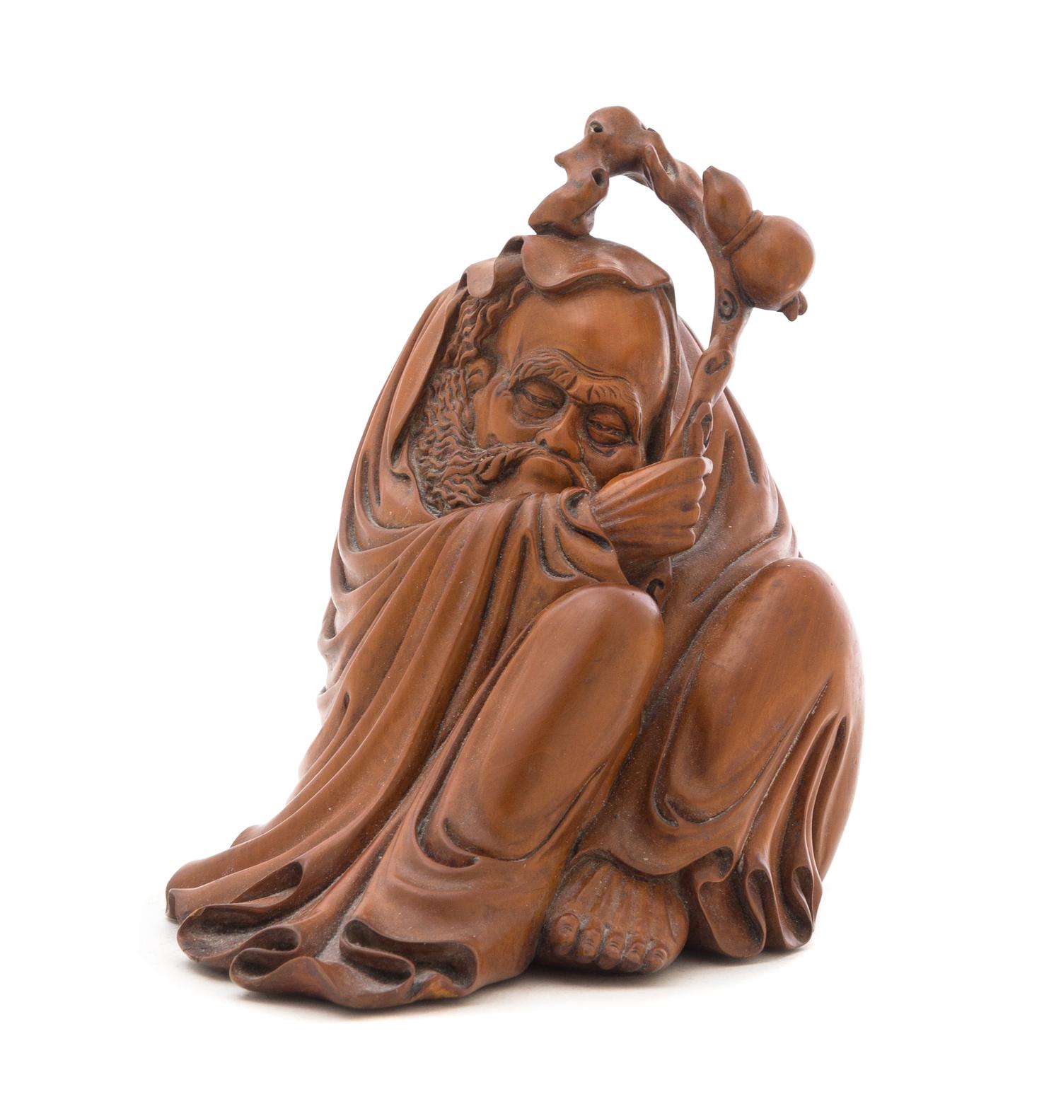 A Carved Rosewood Figure of a Seated Monk Height 7 inches.