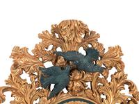 An Italian Baroque Style Gilt Mirror with Ebonized Cherubs