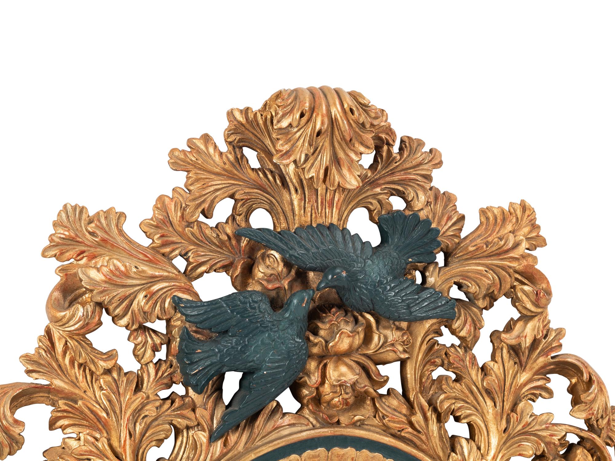 An Italian Baroque Style Gilt Mirror with Ebonized Cherubs