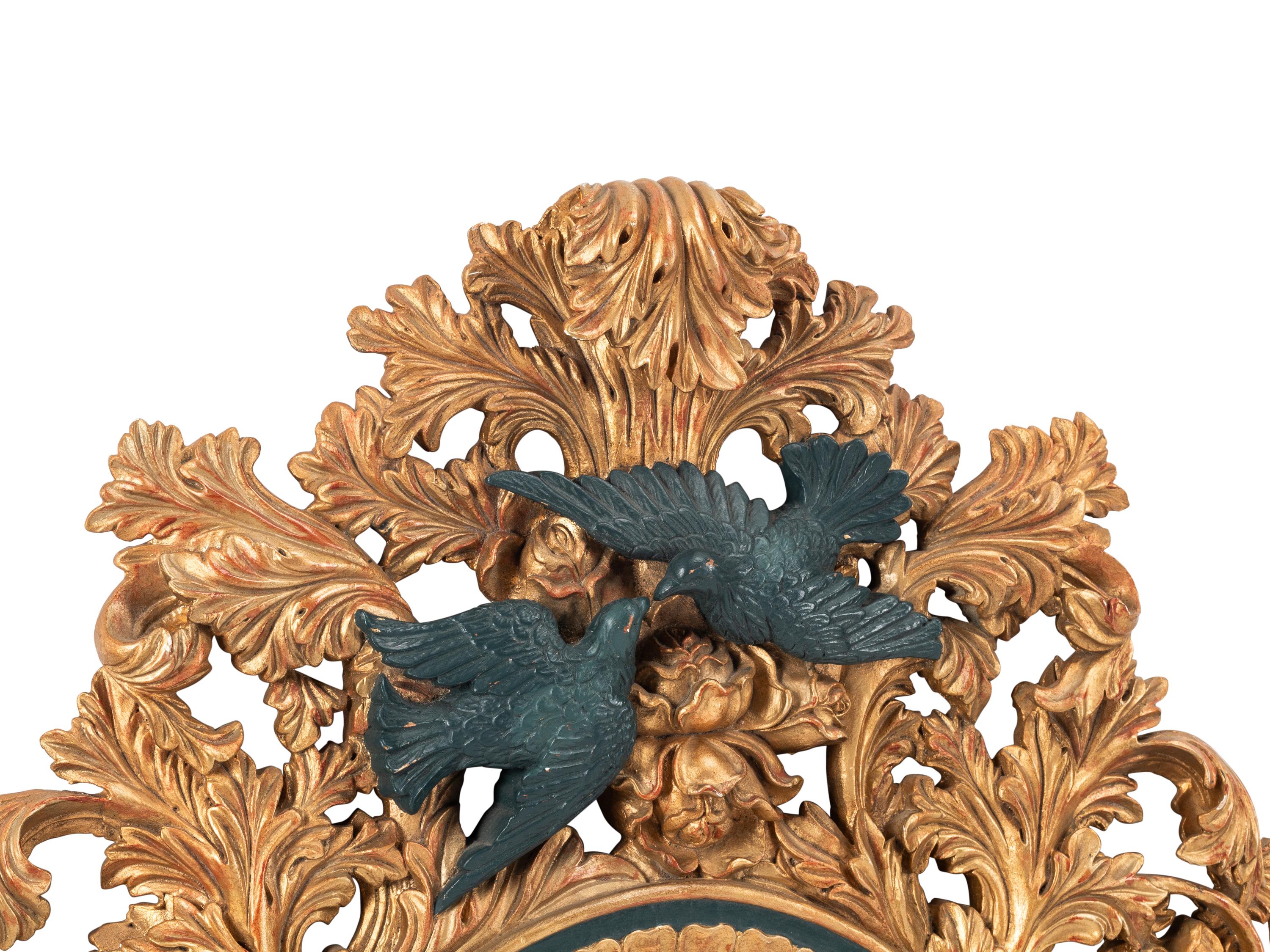 An Italian Baroque Style Gilt Mirror with Ebonized Cherubs
