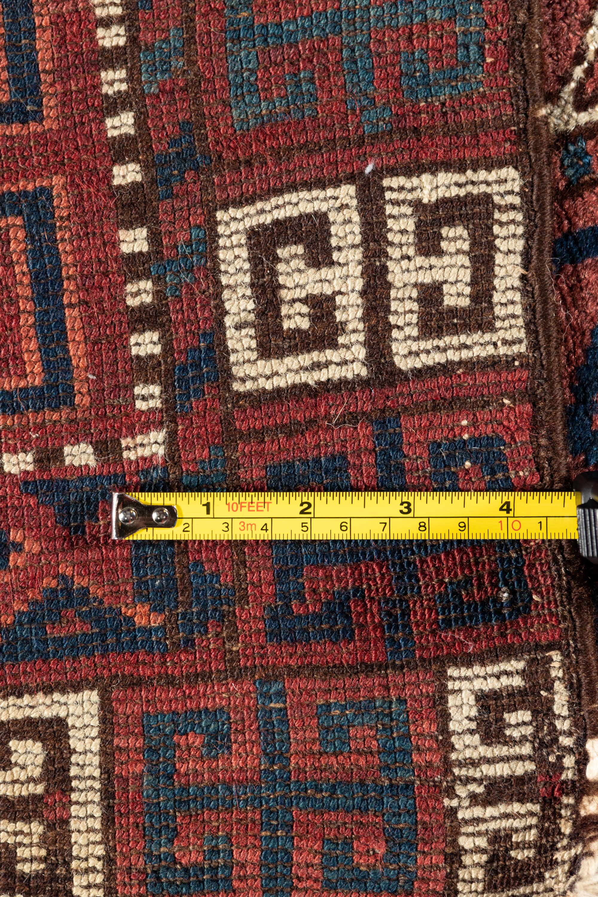 A Turkoman Hatchli Wool Rug