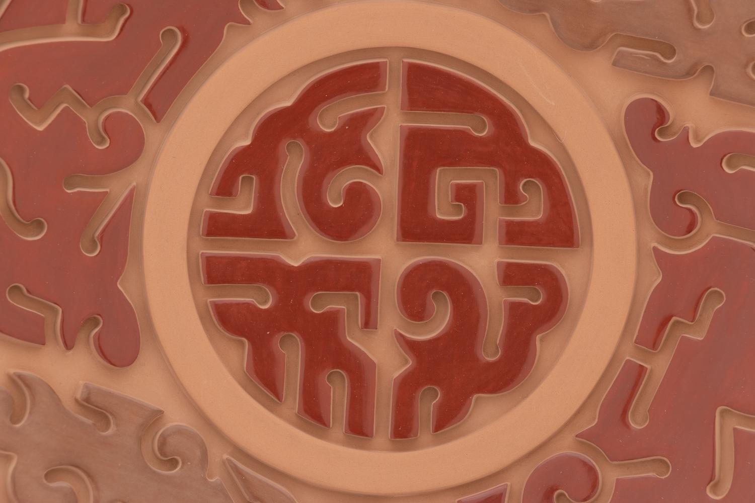 Carved Red and Sienna Pottery Plate