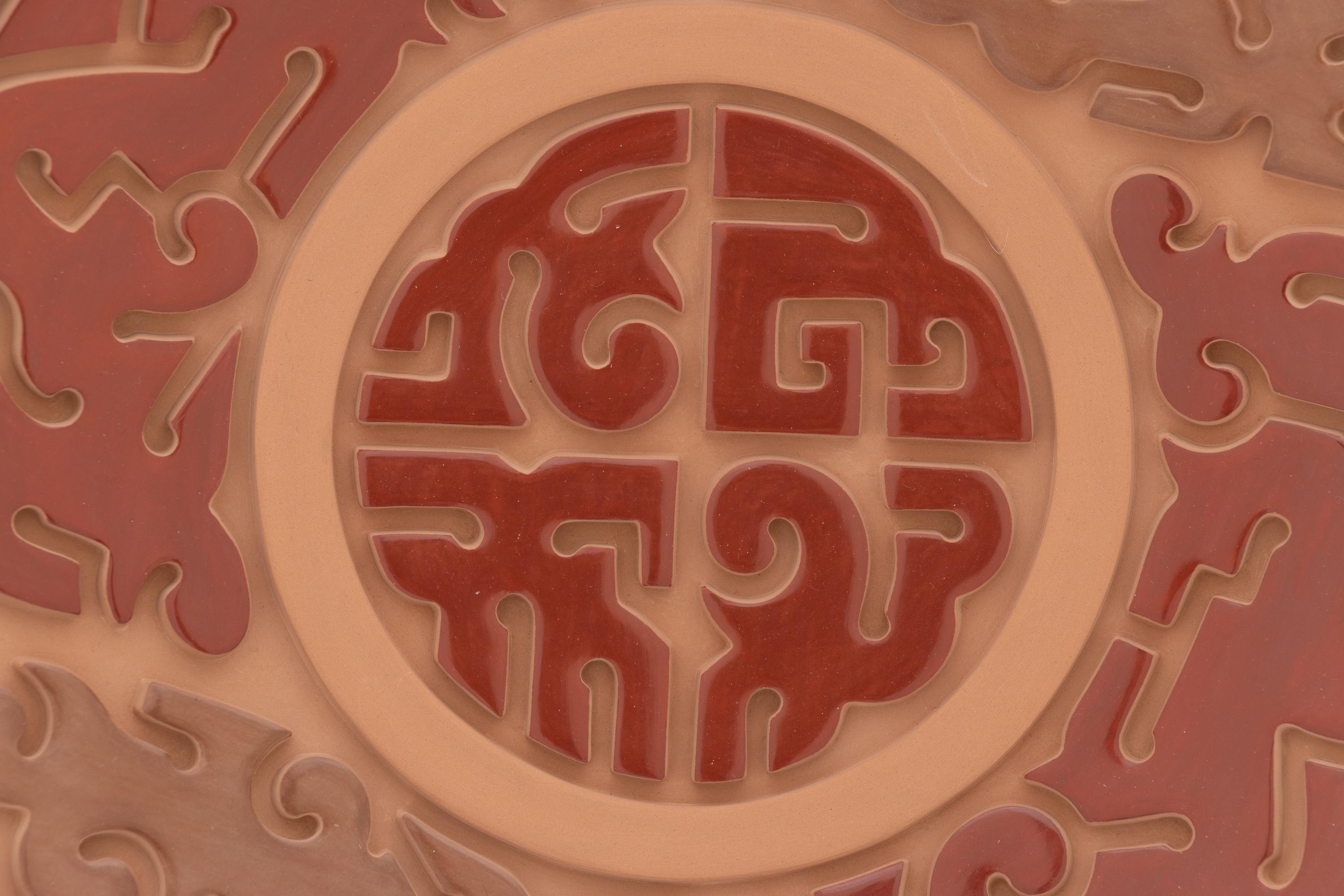 Carved Red and Sienna Pottery Plate