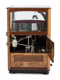 An Exhibit Supply Co. Novelty Candy Vender Claw Machine