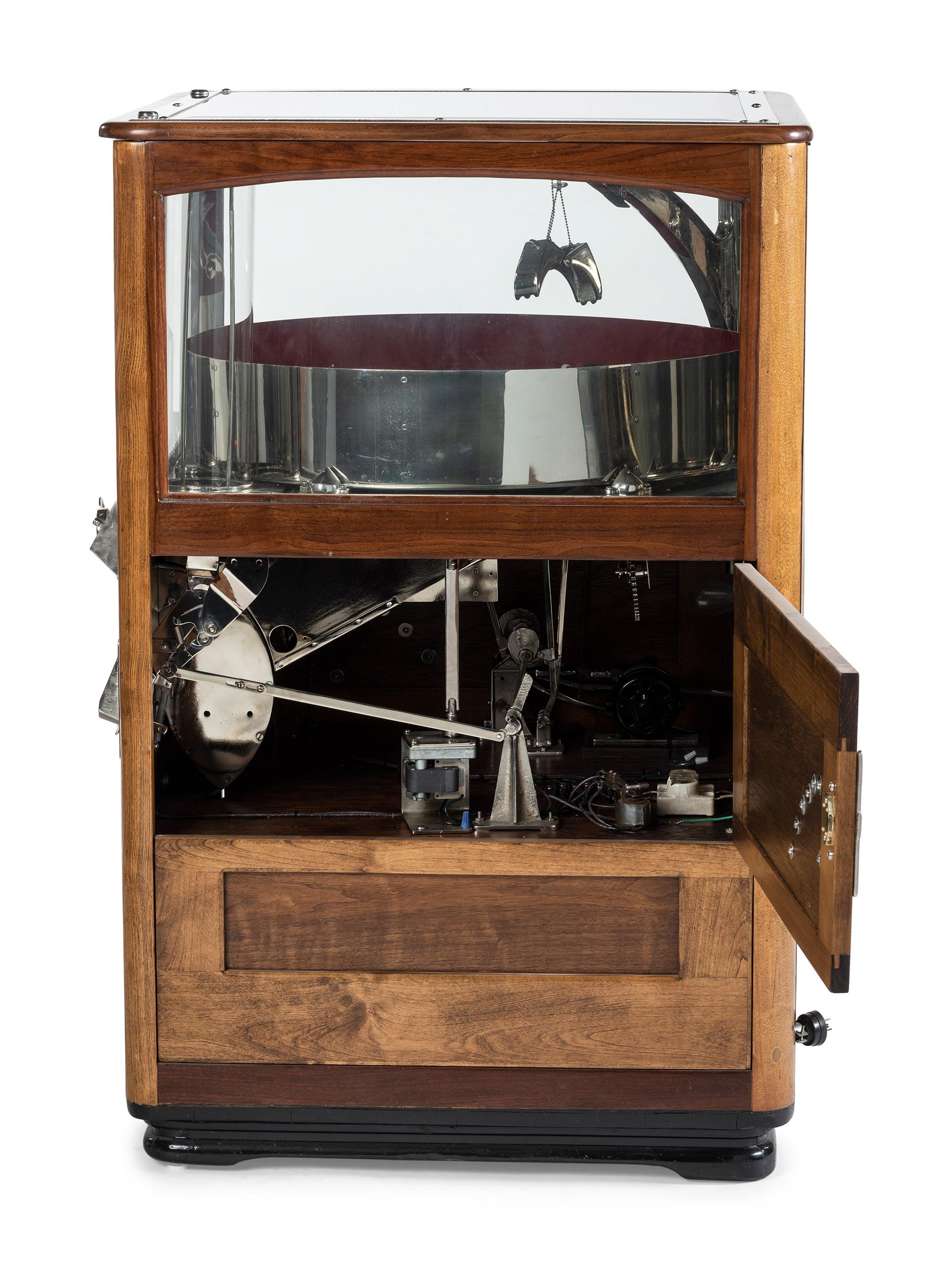 An Exhibit Supply Co. Novelty Candy Vender Claw Machine