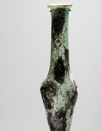 A Roman Pale Blue Glass Unguentarium