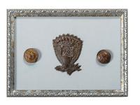 [CIVIL WAR]. A group of Confederate buttons and Union hat insignia framed with engraving, comprising: