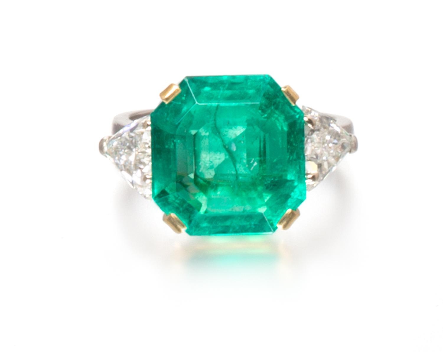 An 18 Karat Yellow Gold, Emerald and Diamond Ring, 4.70 dwts.