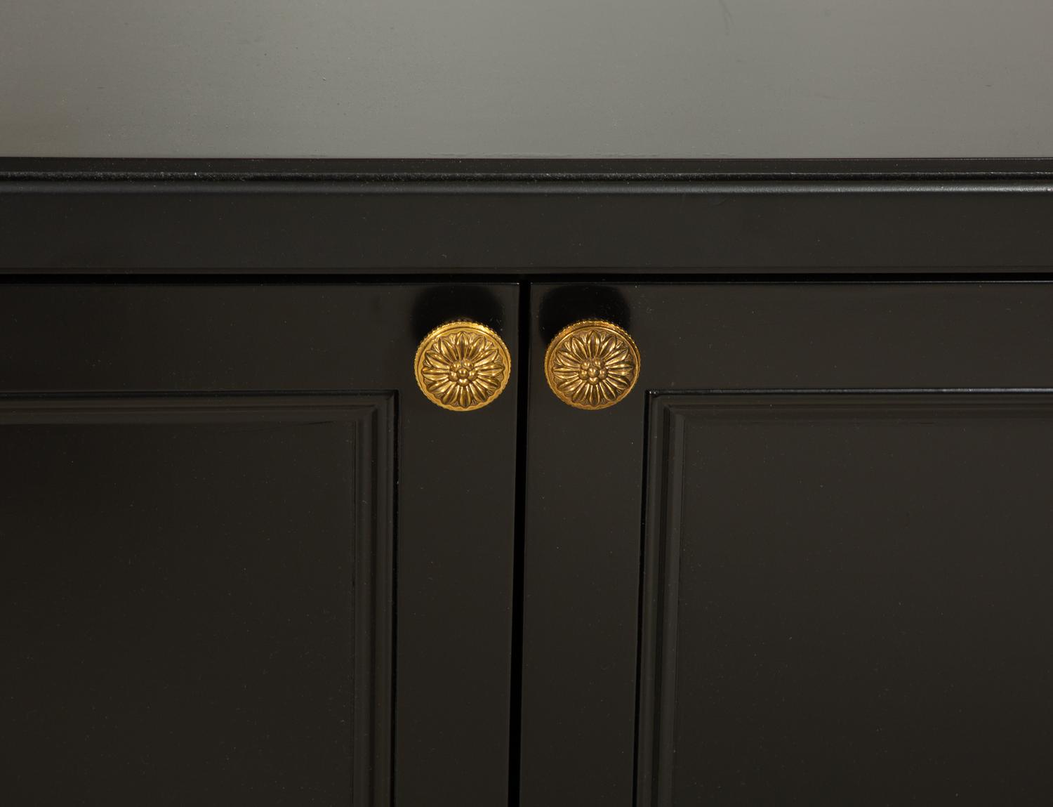 A Pair of Custom Neoclassical Style Black-Painted Bookcases