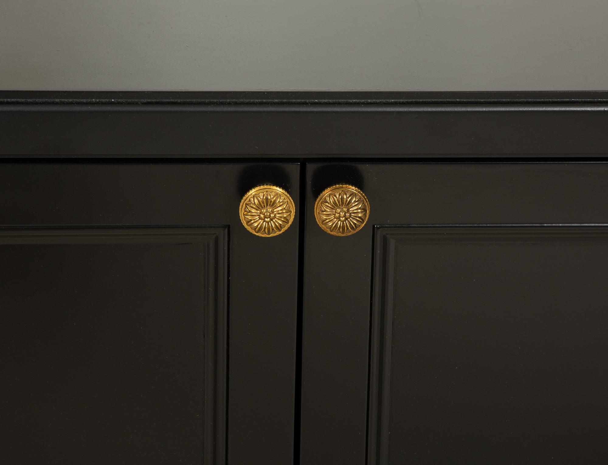 A Pair of Custom Neoclassical Style Black-Painted Bookcases