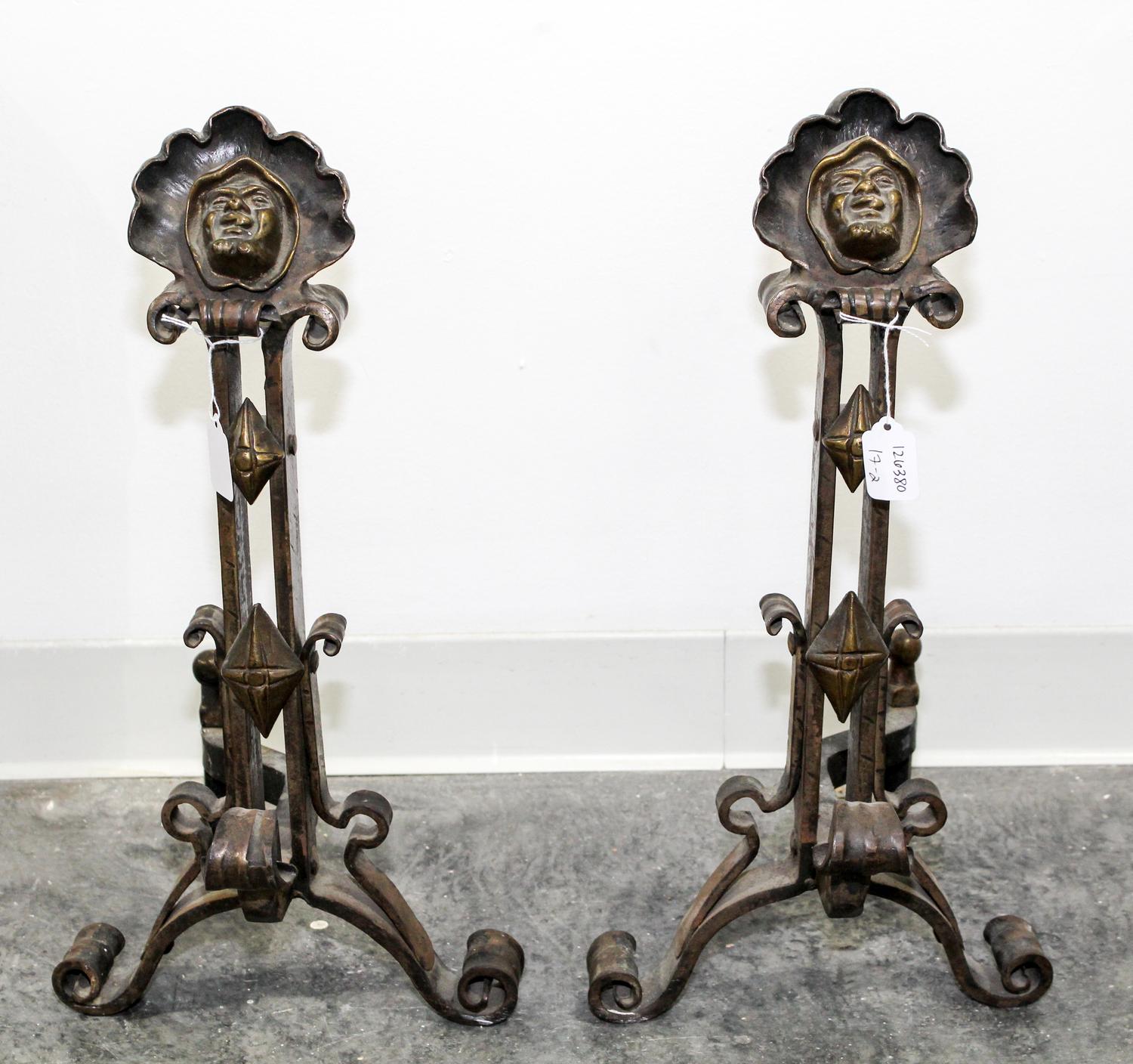 A Pair of Continental Cast Metal Andirons Height 20 inches. — 20TH CENTURY