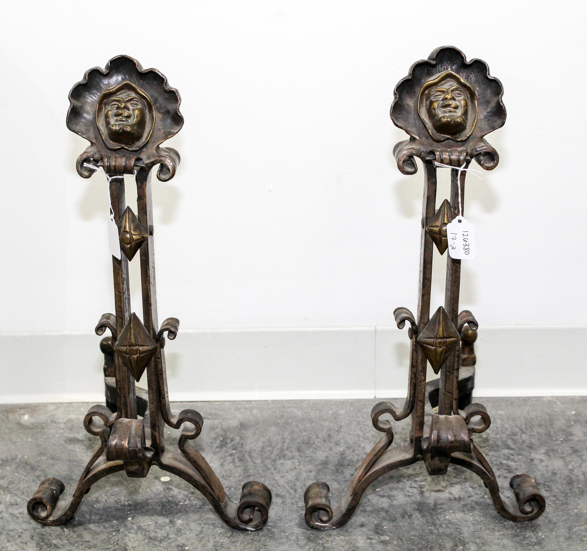 A Pair of Continental Cast Metal Andirons Height 20 inches. — 20TH CENTURY
