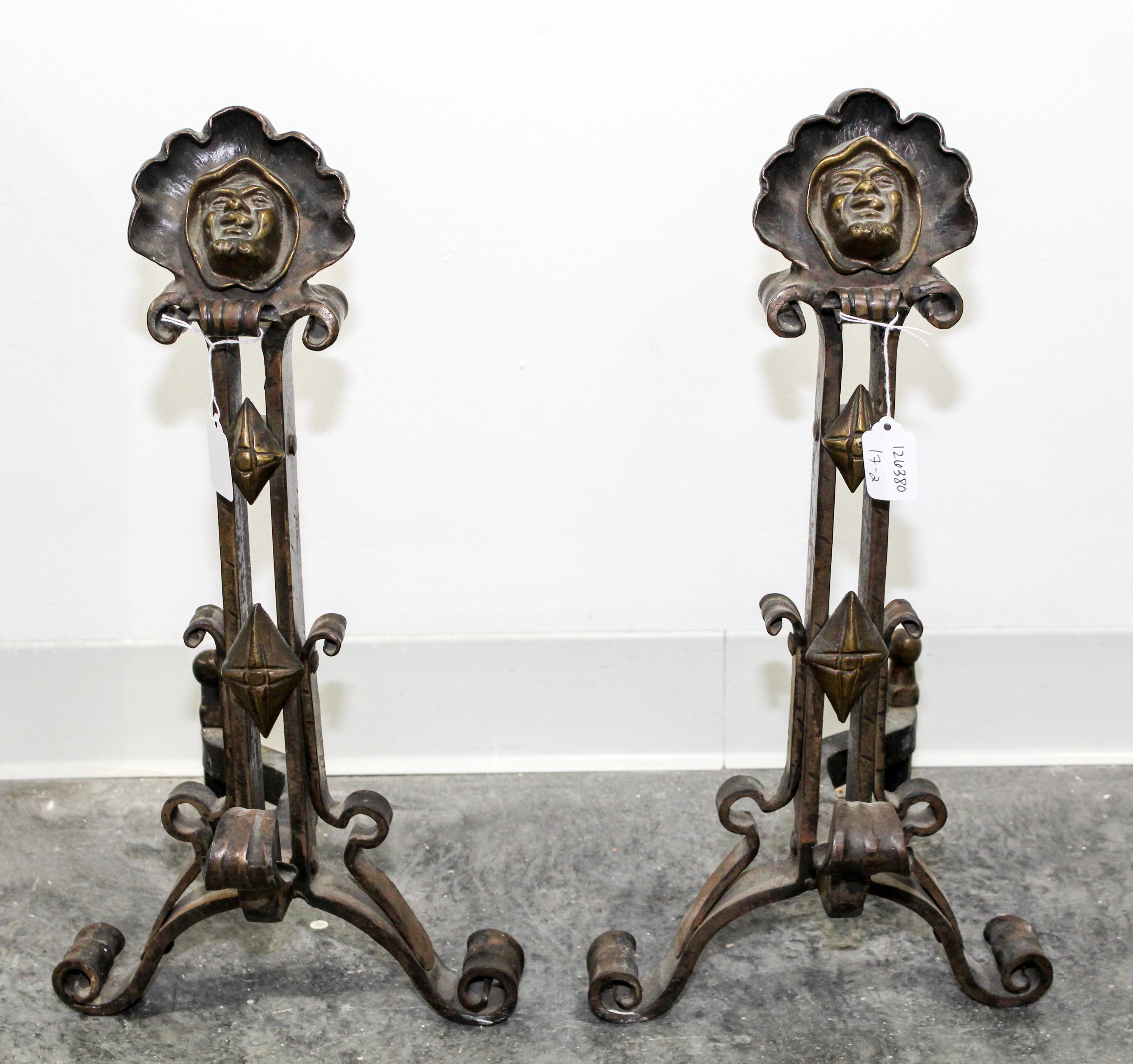 A Pair of Continental Cast Metal Andirons Height 20 inches. — 20TH CENTURY