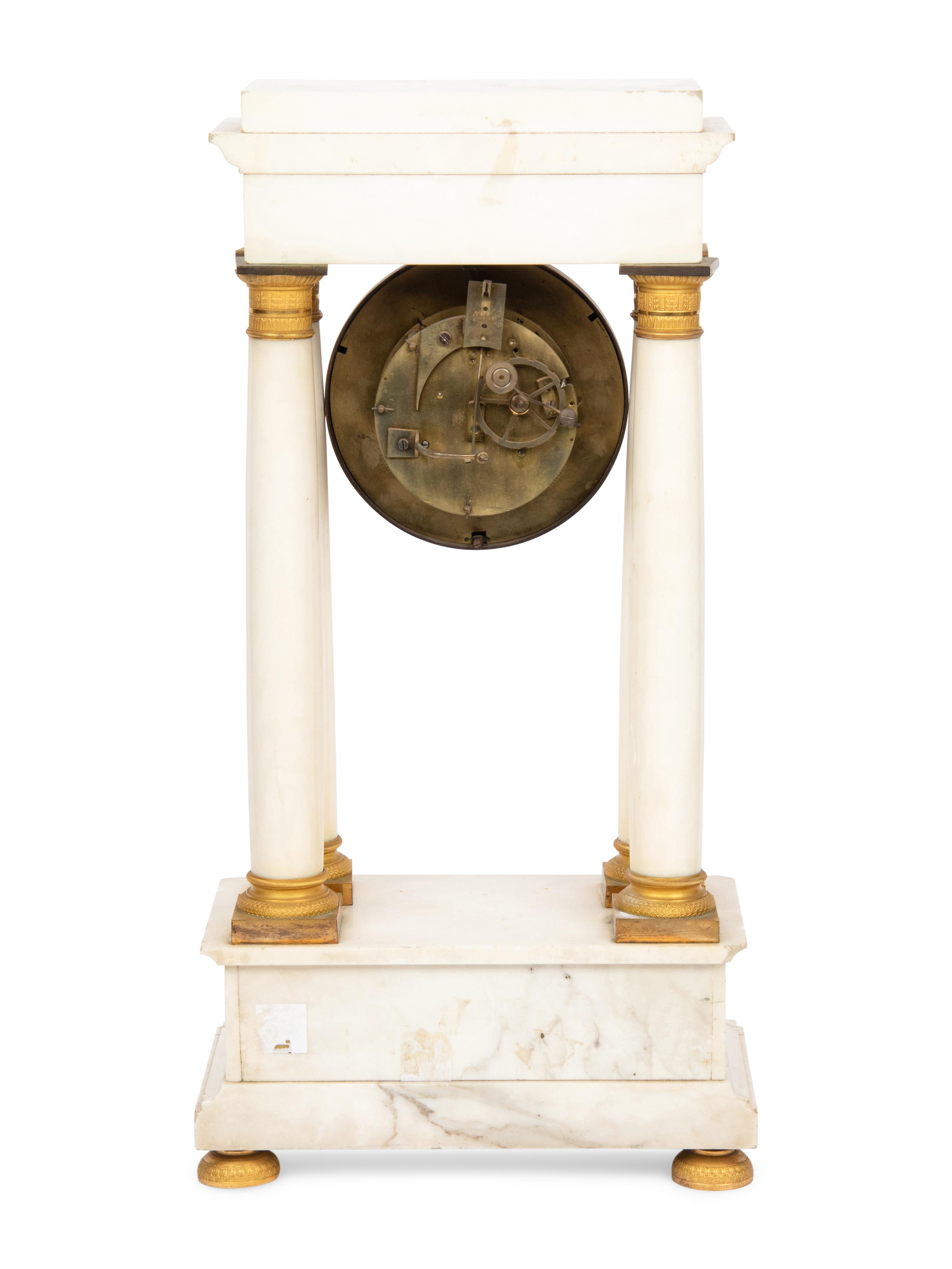A Napoleon III Marble and Gilt Bronze Mounted Portico Clock
