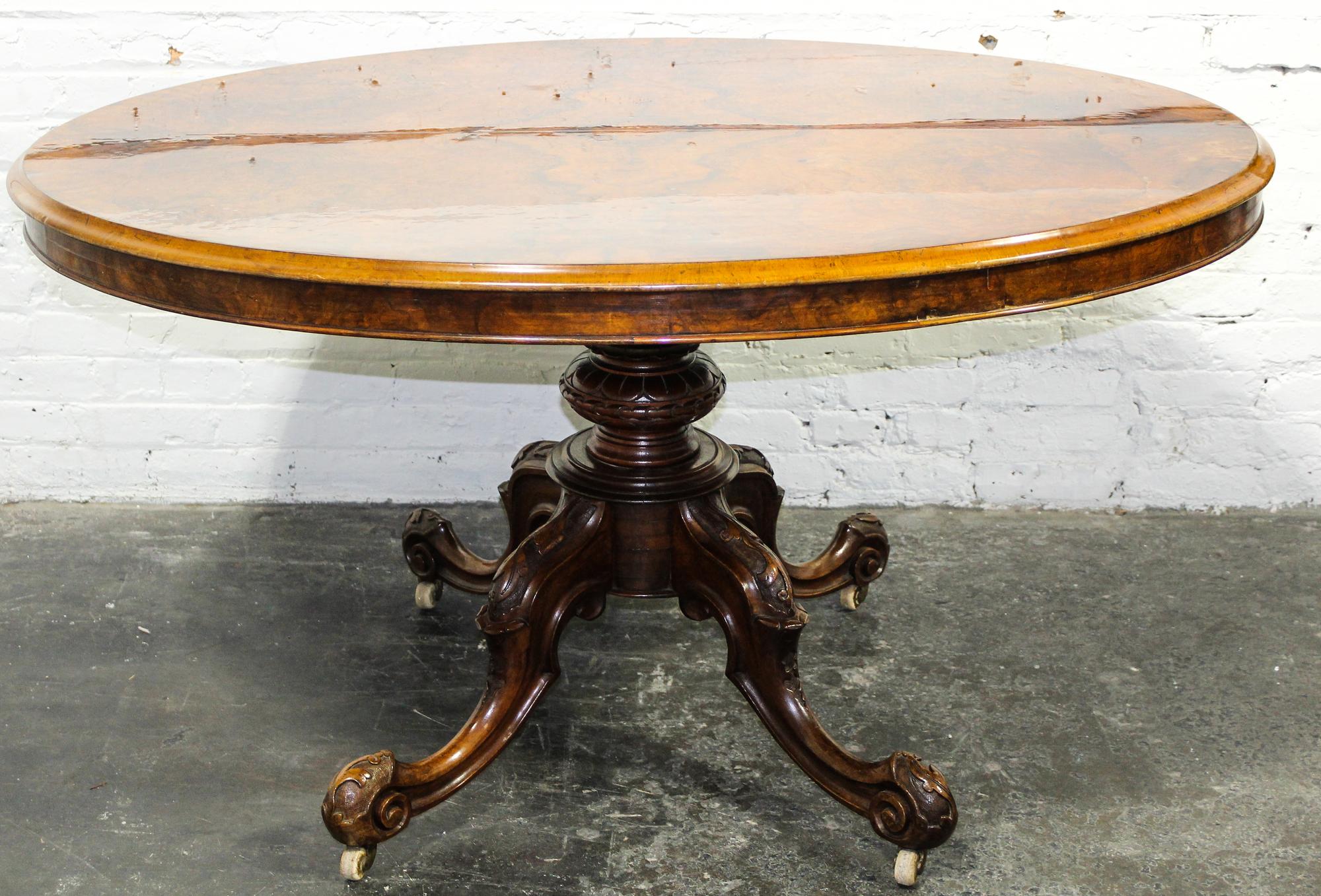 A Burlwood Veneered Breakfast Table Height 29 x width 53 x depth 39 1/4 inches.