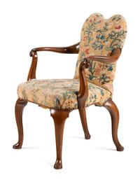 A George I Walnut and Needlework Upholstered Armchair
