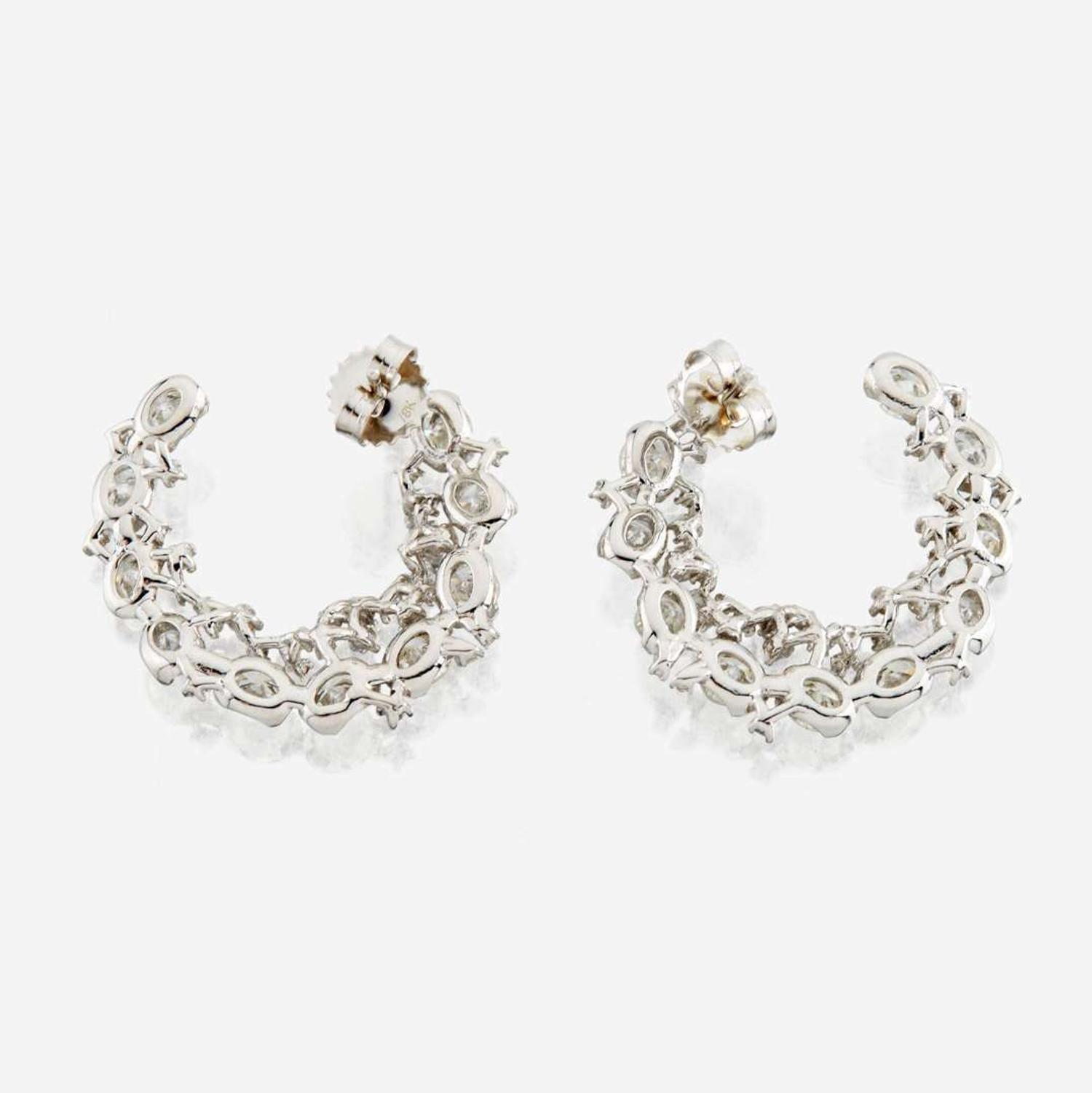 A pair of diamond and white gold earrings