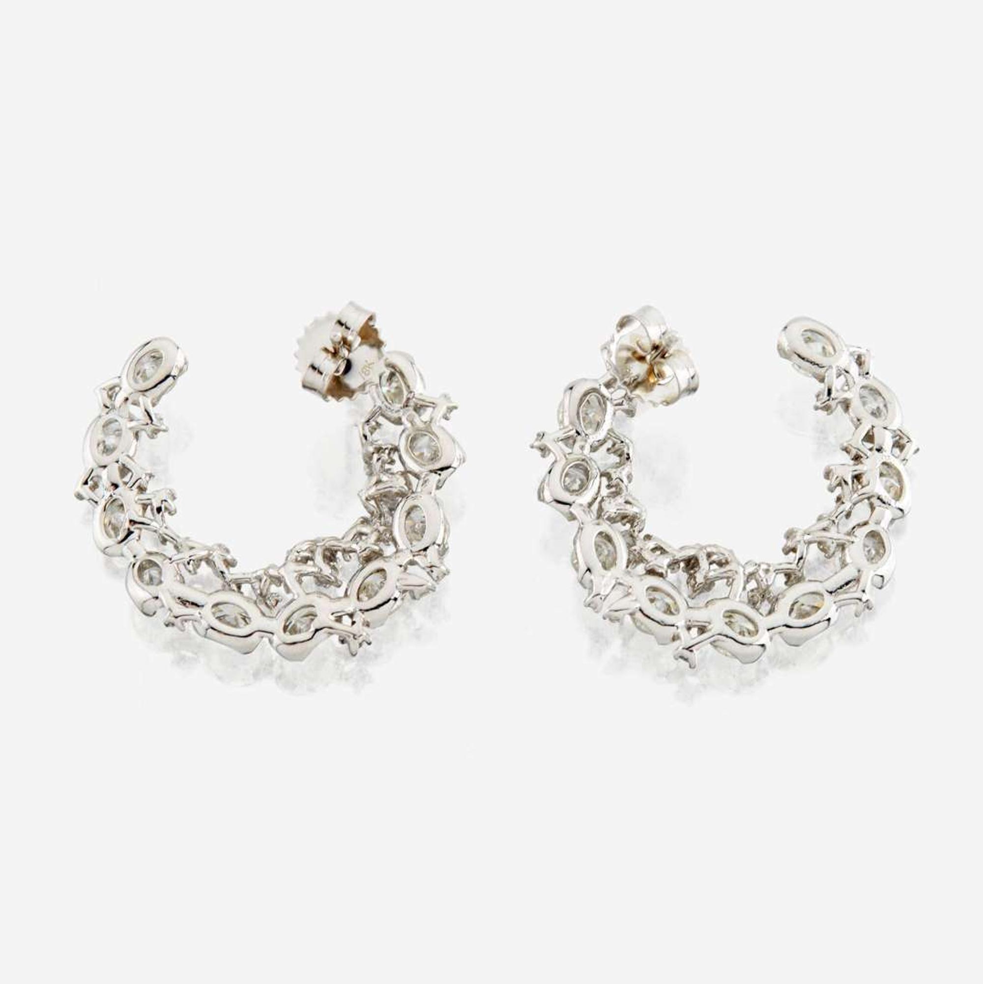 A pair of diamond and white gold earrings