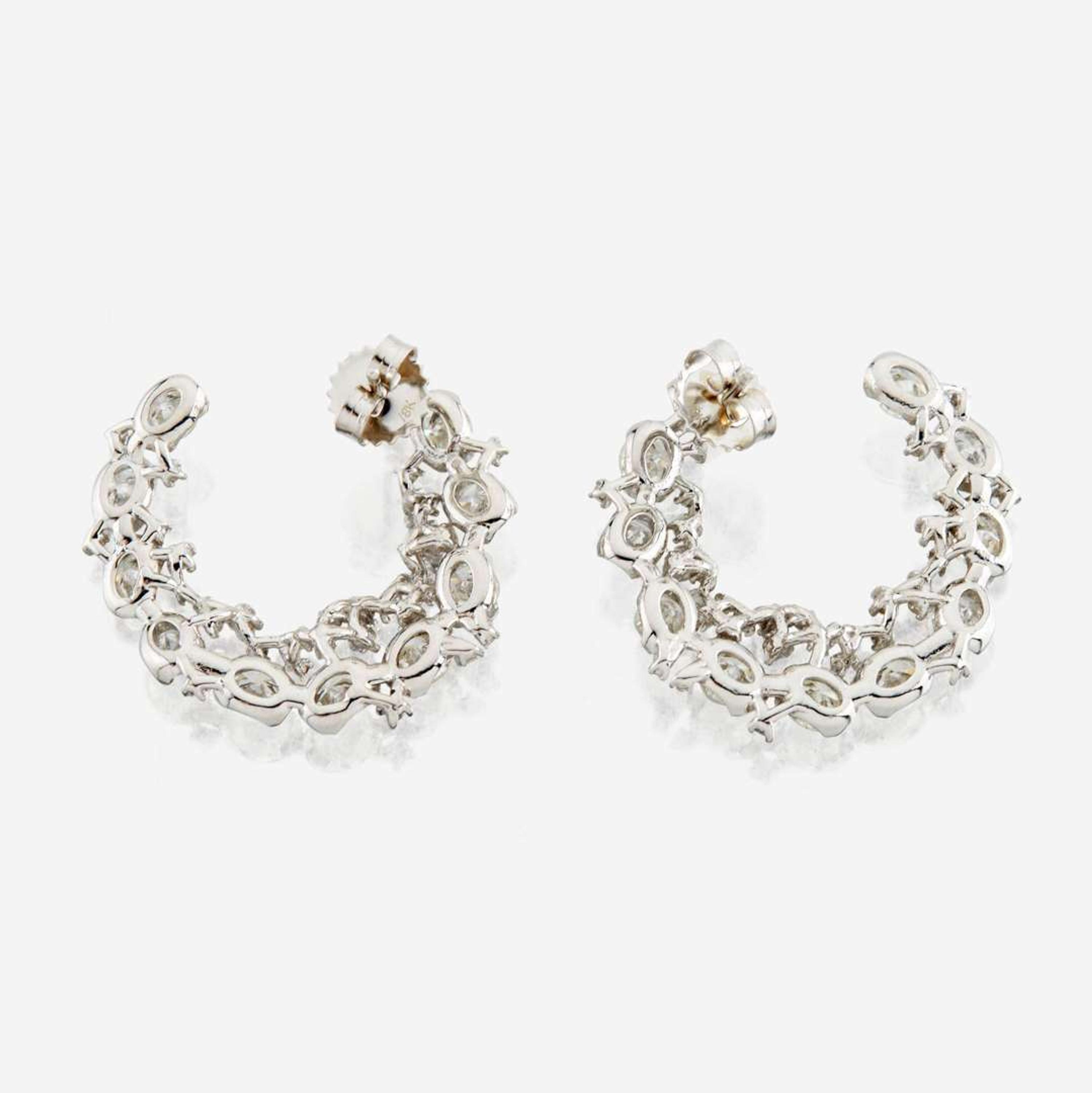 A pair of diamond and white gold earrings