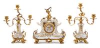 A Berlin (K.P.M.) Porcelain and Gilt Bronze Clock Garniture Height of candelabra 13 inches. — 19TH CENTURY