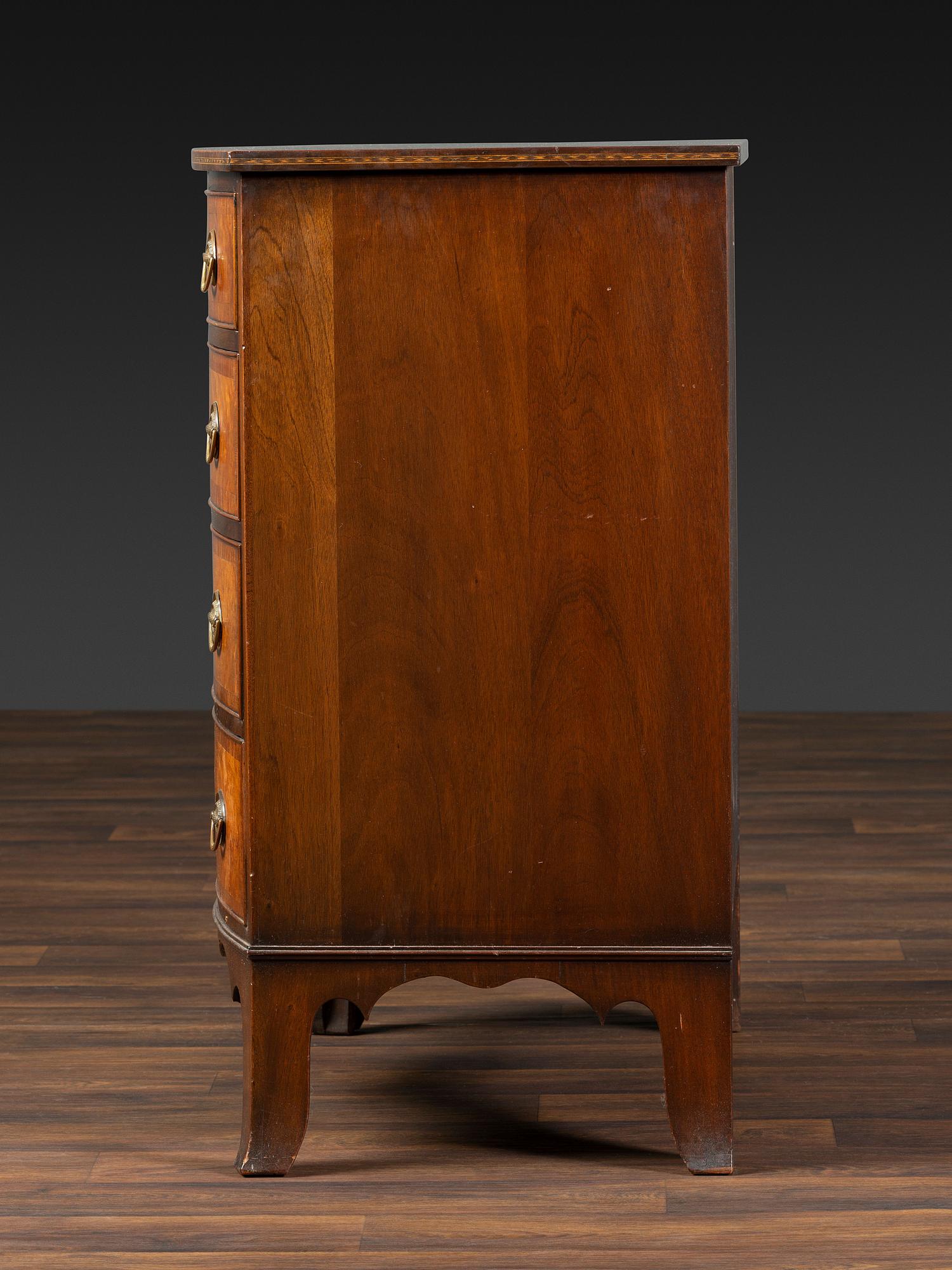 A Federal Inlaid and Figured Mahogany Bow-Front Chest of Drawers