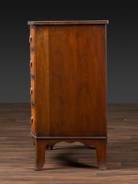A Federal Inlaid and Figured Mahogany Bow-Front Chest of Drawers