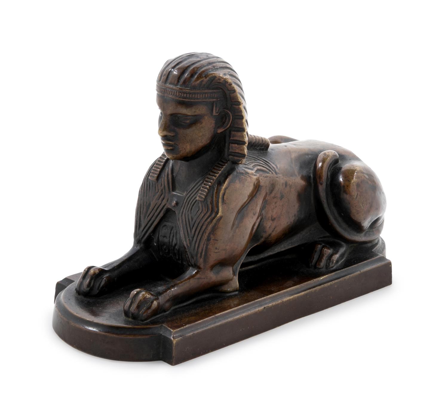 A Continental Grand Tour Patinated Bronze Sphinx