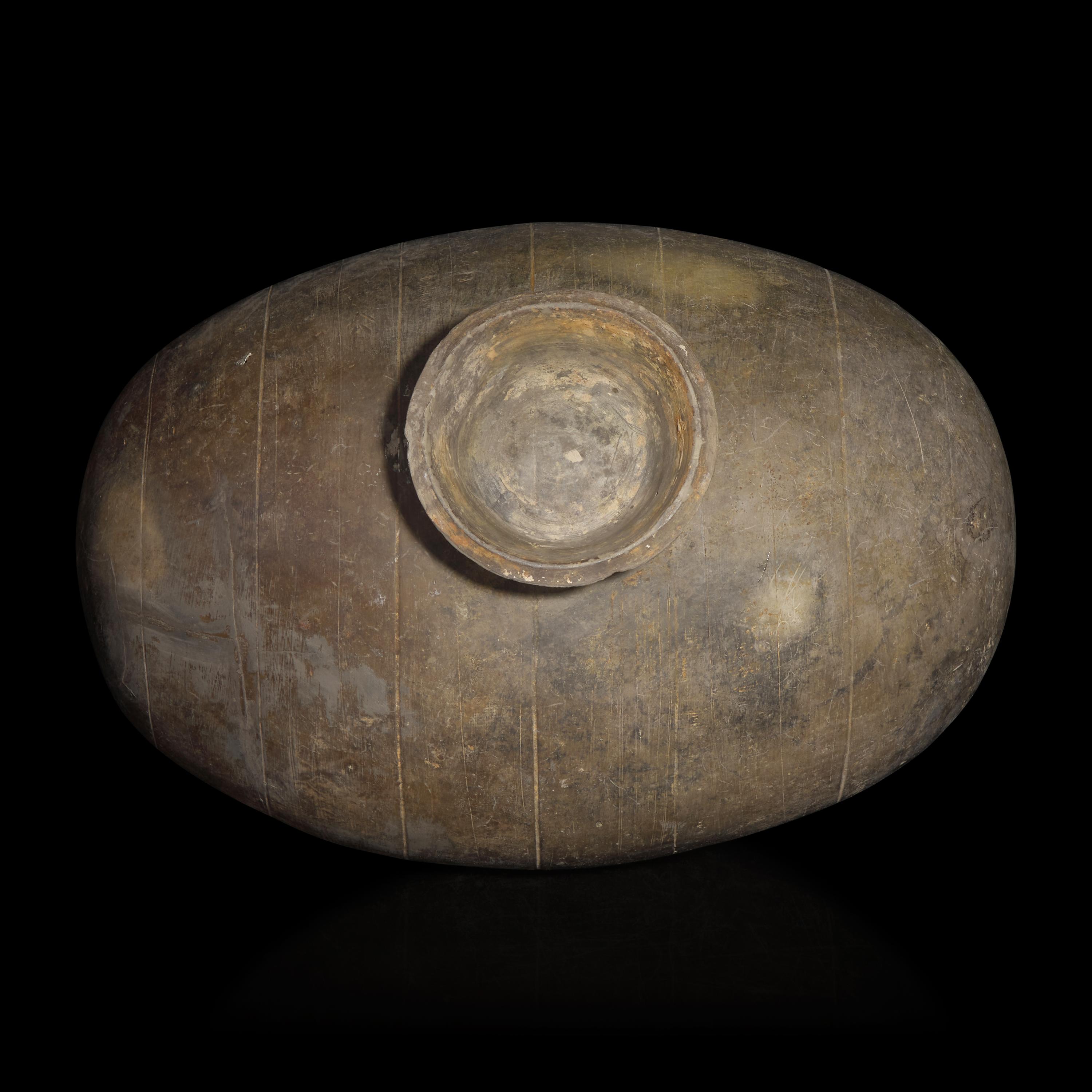 A Chinese Grey Pottery Cocoon Jar, Han Dynasty — 漢 灰陶繭形罐
