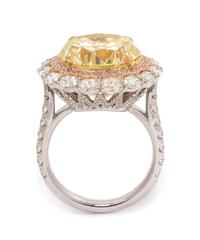 An 18 Karat Tricolor Gold, Fancy Yellow Diamond, Diamond and Colored Diamond Ring, 10.10 dwts.