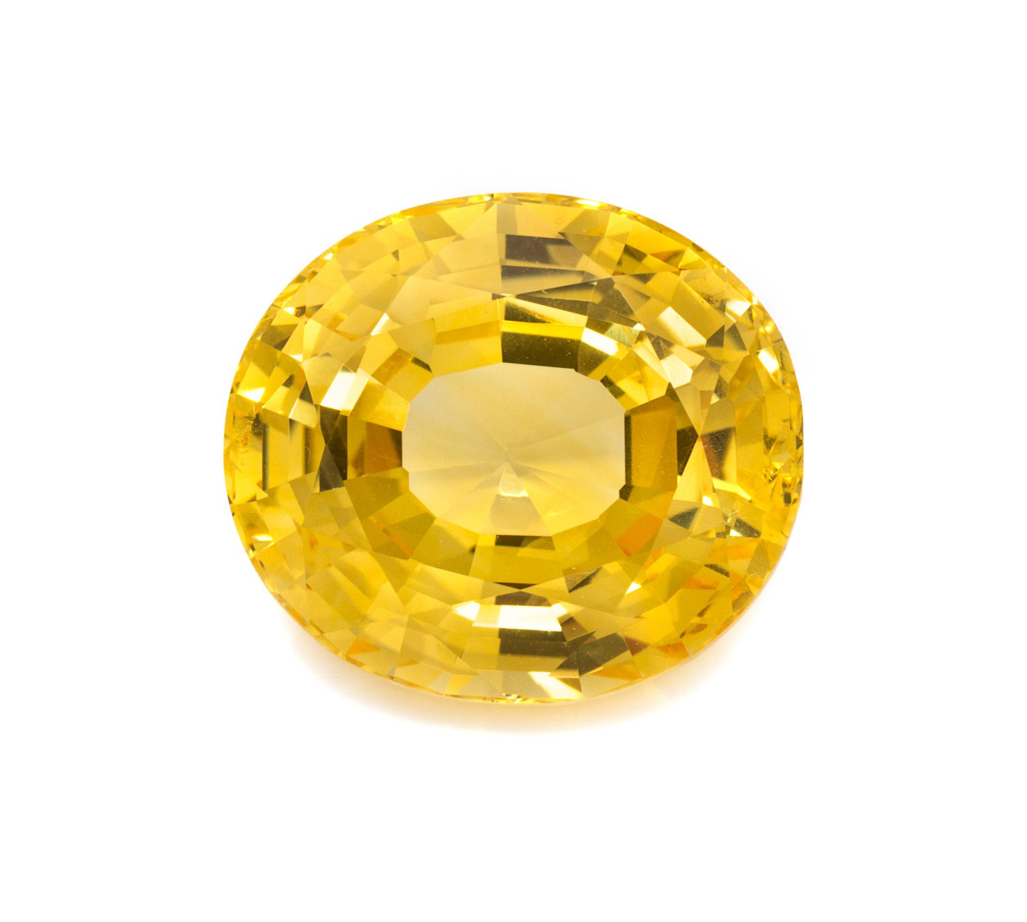 A 21.39 Carat Oval Mixed Cut Unheated Ceylon Yellow Sapphire, 3.90 dwts.