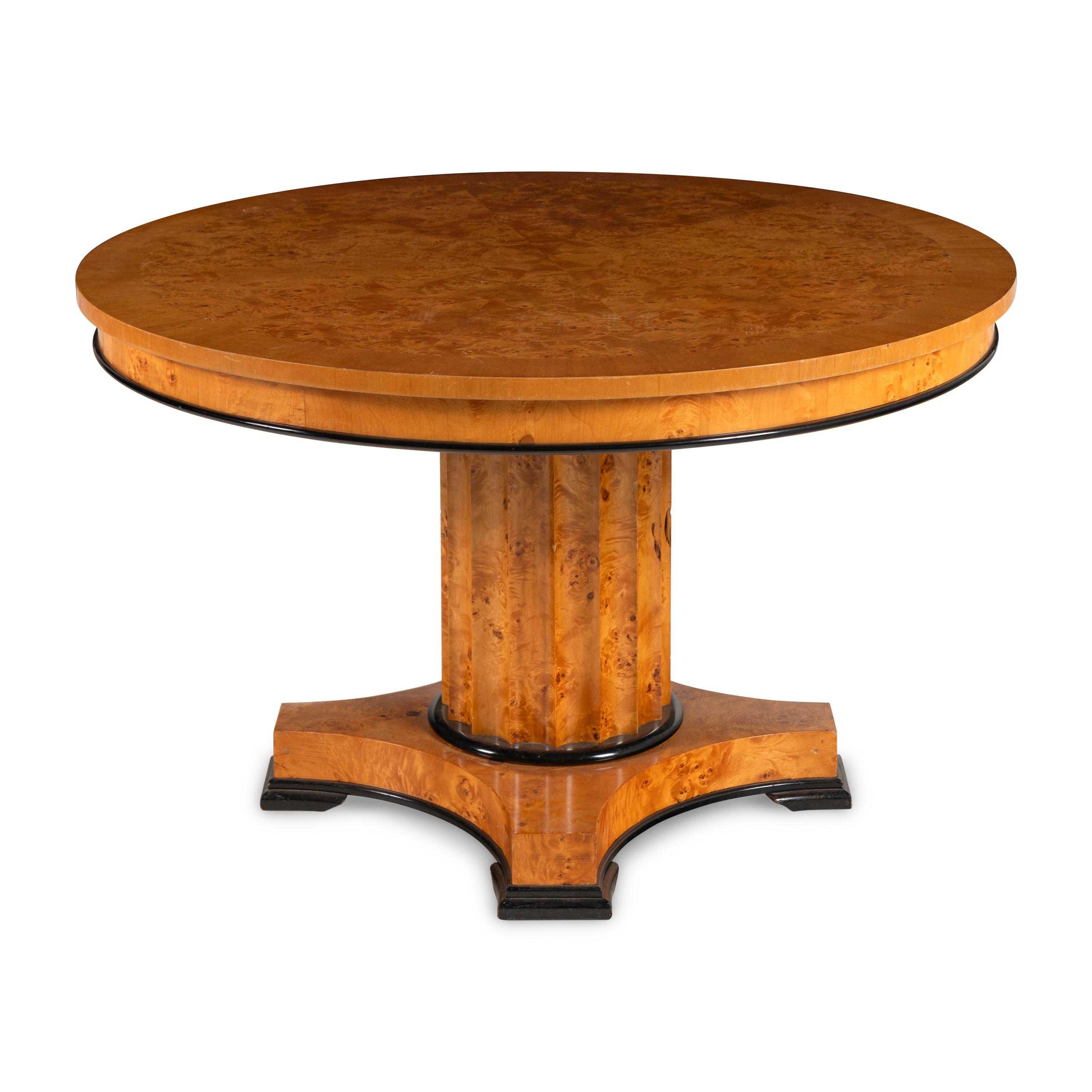 A Biedermeier Style Parcel Ebonized Figured Birch Center Table