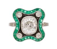 An Art Deco Platinum, Diamond, Emerald and Onyx Ring, 3.90 dwts.