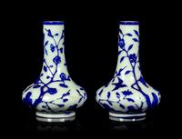 A Pair of Chinese Blue Overlay Opaque White Glass Bottle Vases