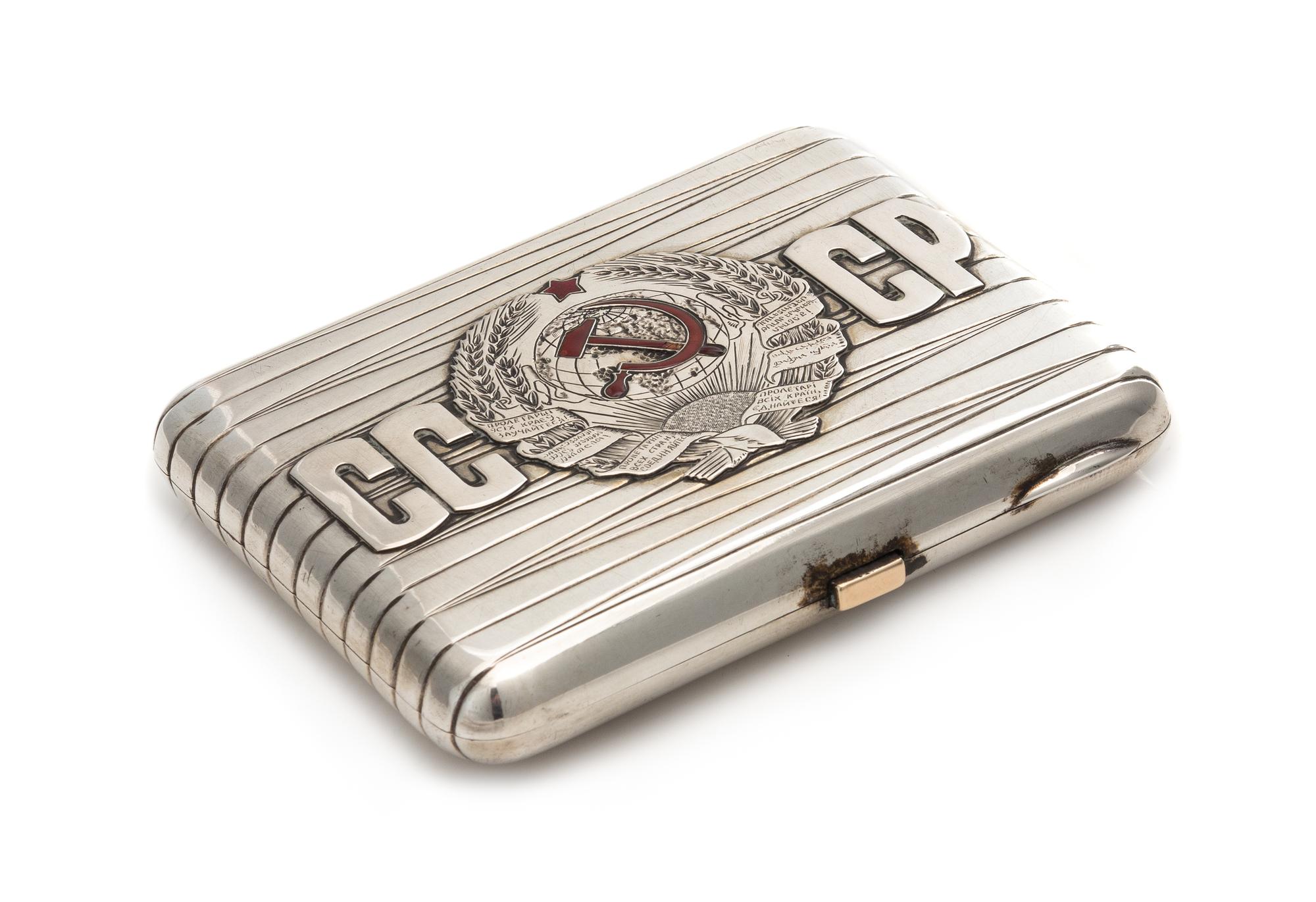 A Soviet-Era Latvian Silver Cigarette Case, Maker's Mark Cyrillic MYu4, Riga, Mid-20th Century, the banded case with applied letters an