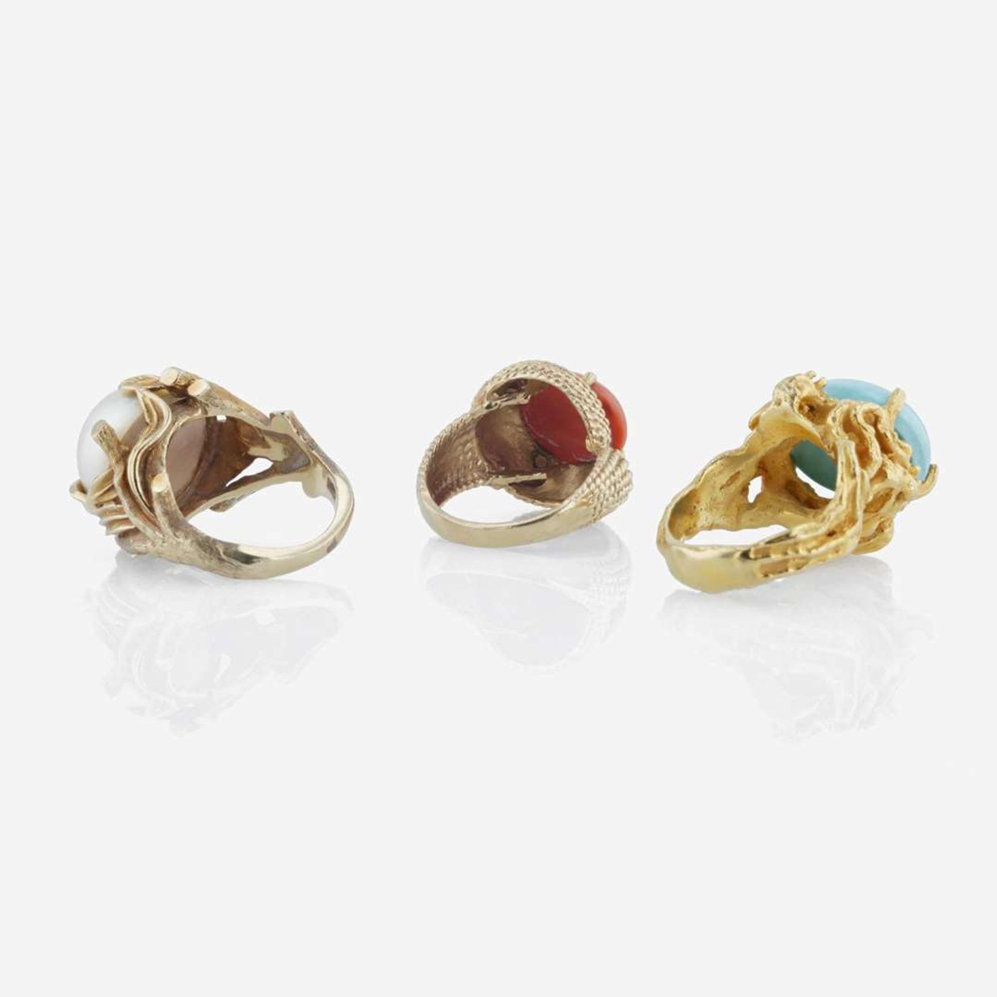 A collection of three 14K yellow gold and gem-set rings