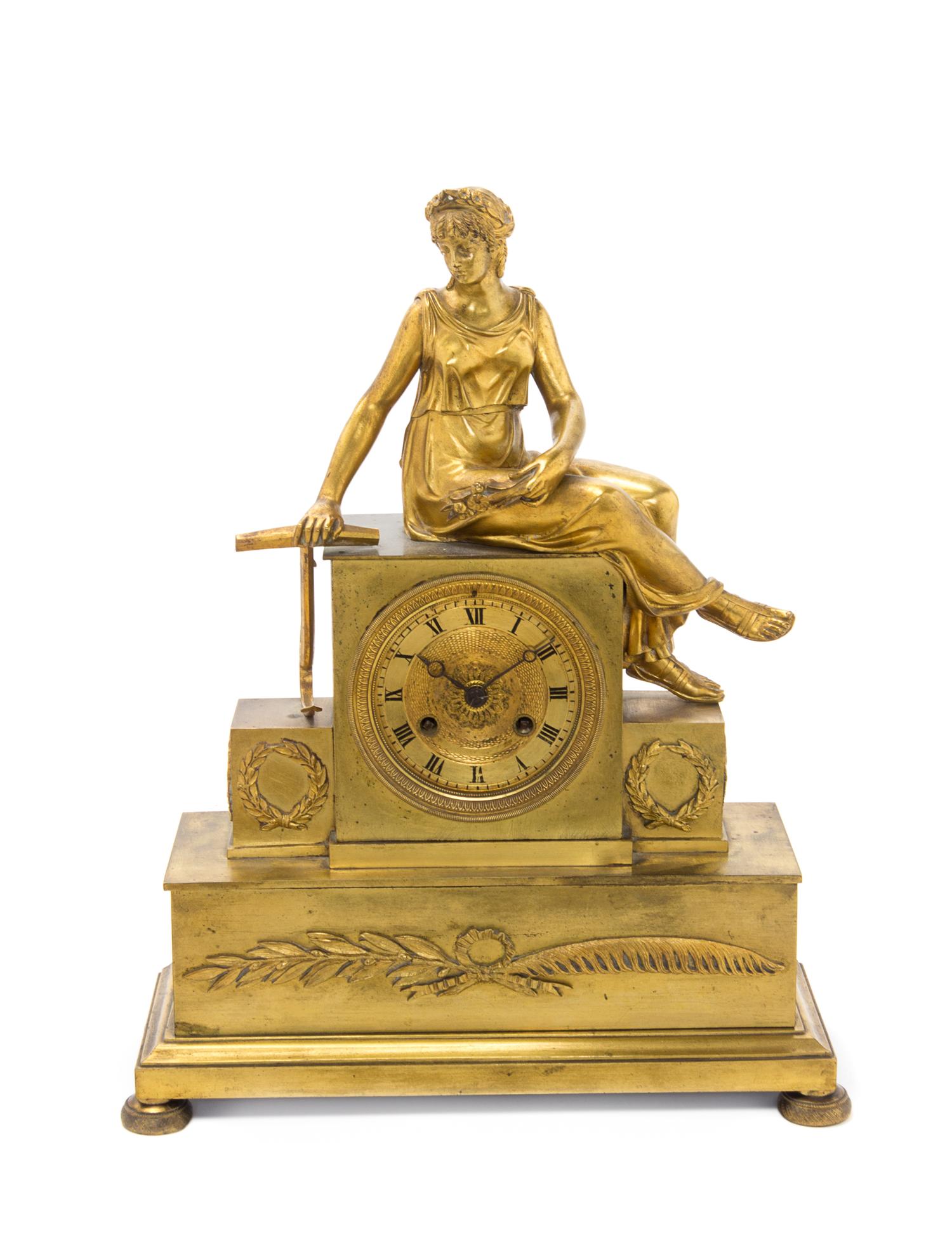 An Empire Gilt Bronze Mantel Clock Height 15 1/2 inches. — FIRST HALF 19TH CENTURY