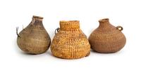 Three Southwestern Bottle Form Baskets Height of tallest 7 inches.