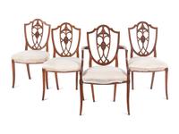 A Set of Four Federal Carved Cherrywood Shield-Back Dining Chairs