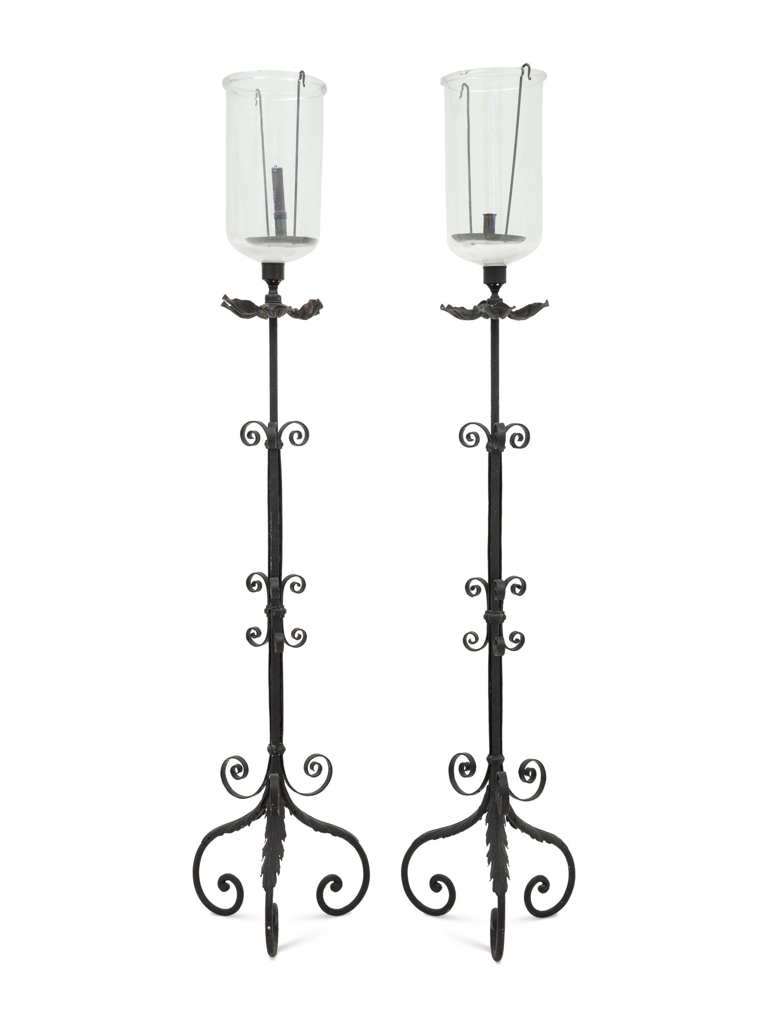 A Pair of Spanish Colonial Style Wrought Iron Floor Lanterns
