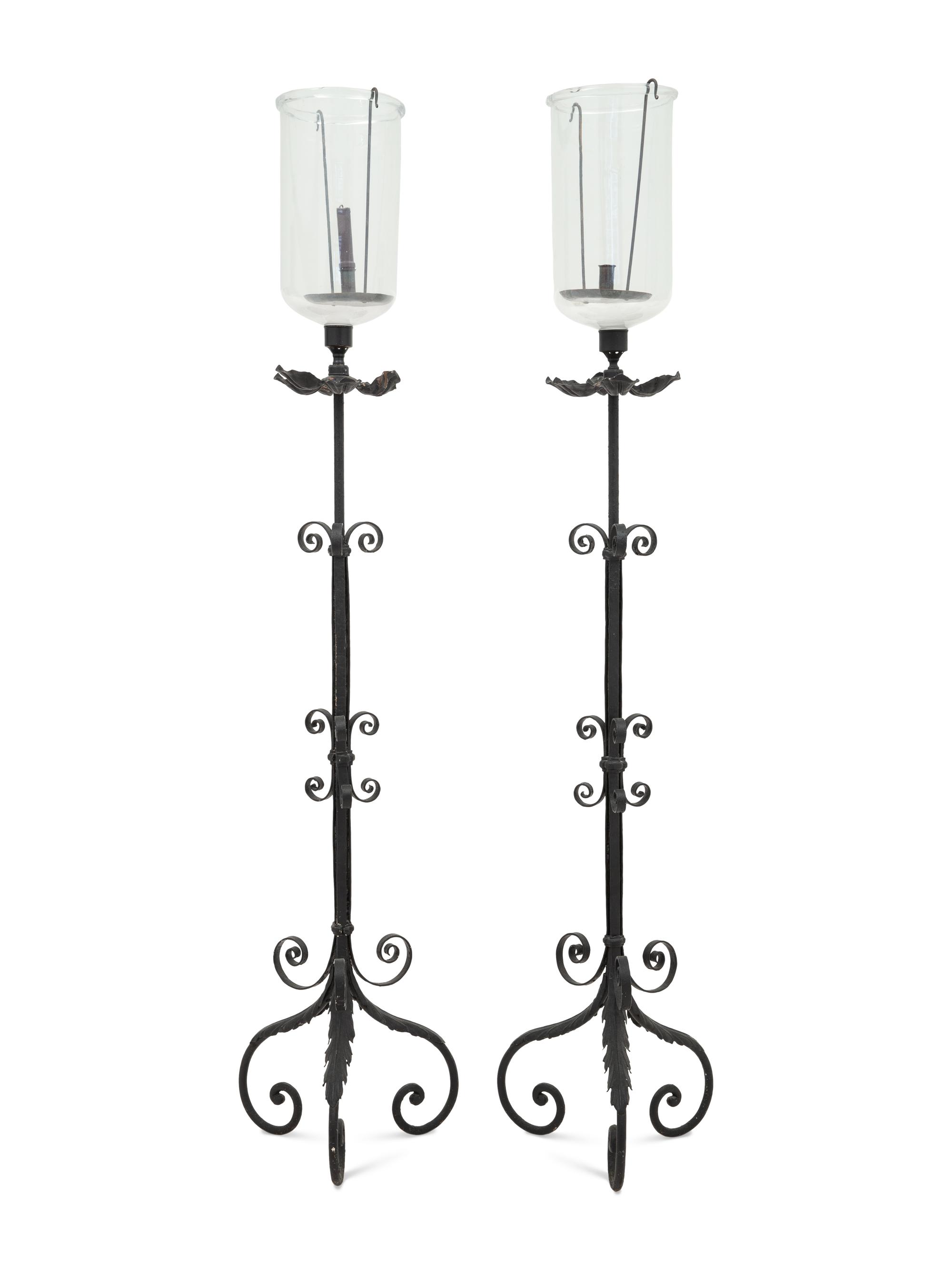 A Pair of Spanish Colonial Style Wrought Iron Floor Lanterns
