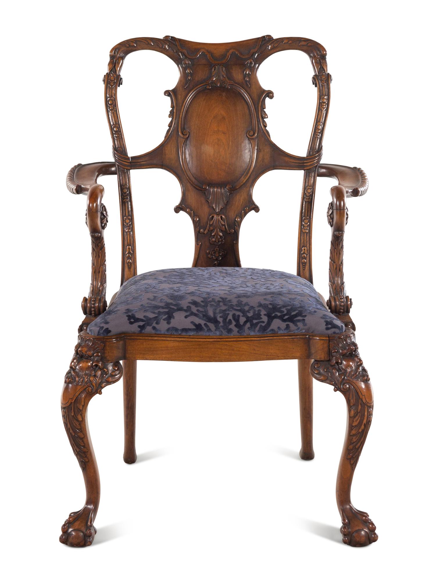 An Irish George I Style Carved Walnut Armchair