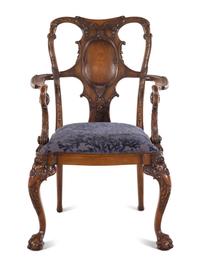 An Irish George I Style Carved Walnut Armchair