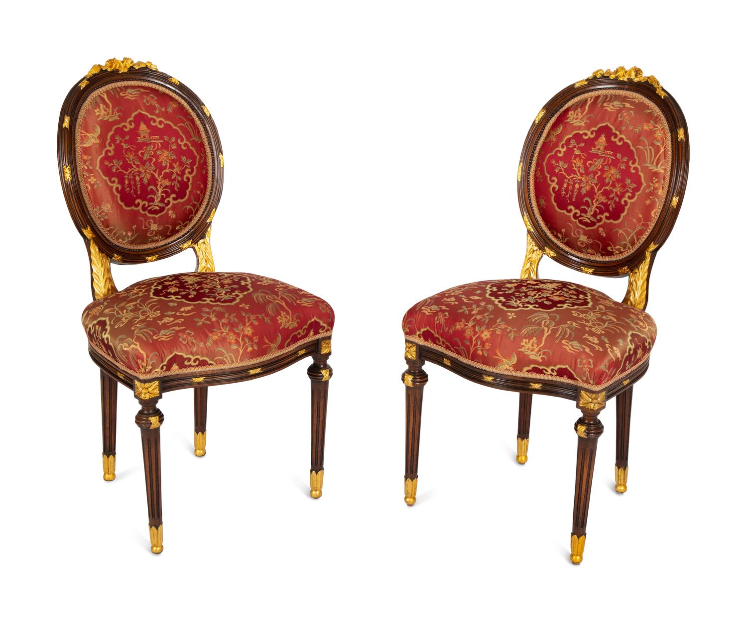 A Pair of Louis XVI Style Stained and Gilt Mahogany Side Chairs.