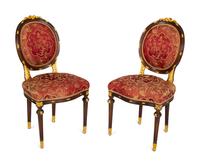 A Pair of Louis XVI Style Stained and Gilt Mahogany Side Chairs.