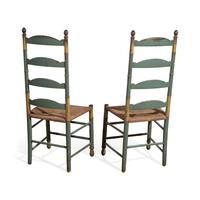 A Pair of Green-Painted and Decorated Ladder-Back Rush-Seat Side Chairs