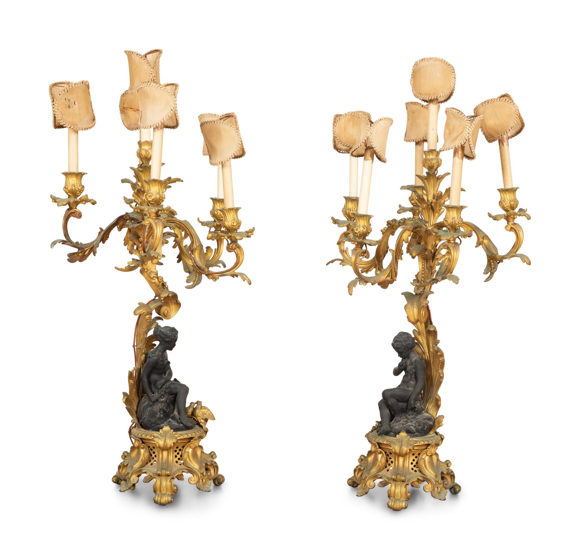 A Pair of Louis XV Style Gilt and Patinated Bronze Figural Six-Light Candelabra