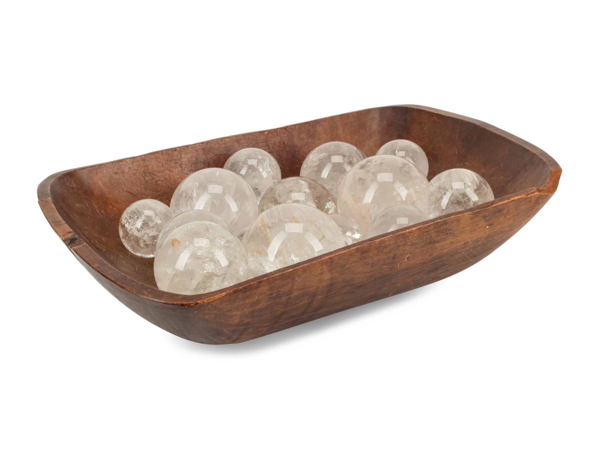 A Continental Carved Wood Dough Bowl and a Collection of Rock Crystal Ornaments