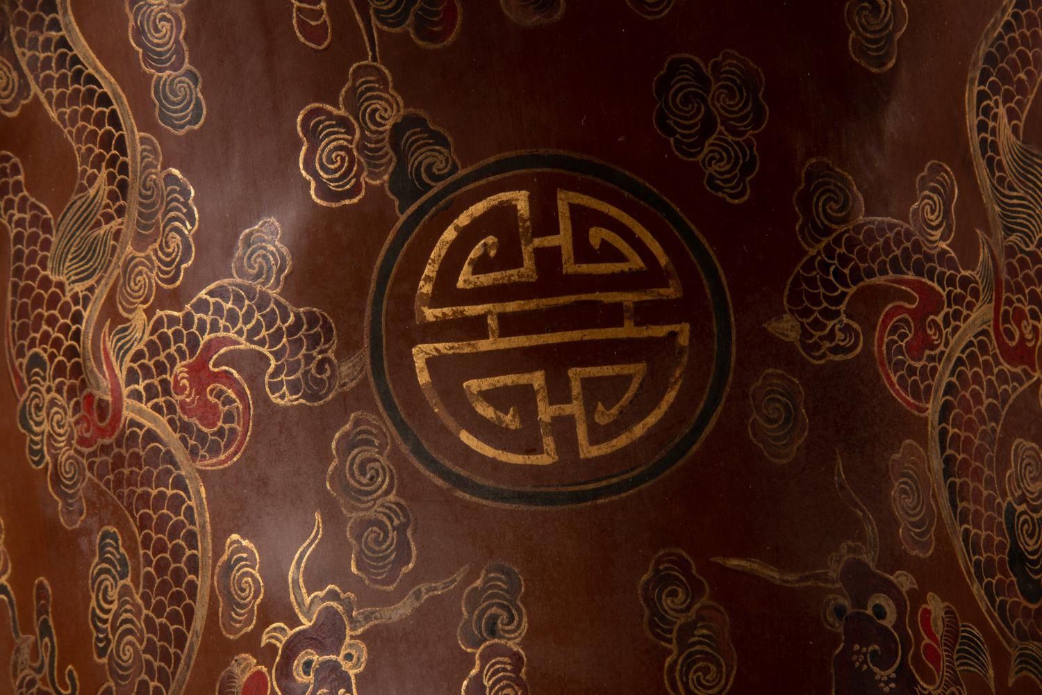 A Gilt and Polychrome Painted Red Lacquer Saddle and Two Pads