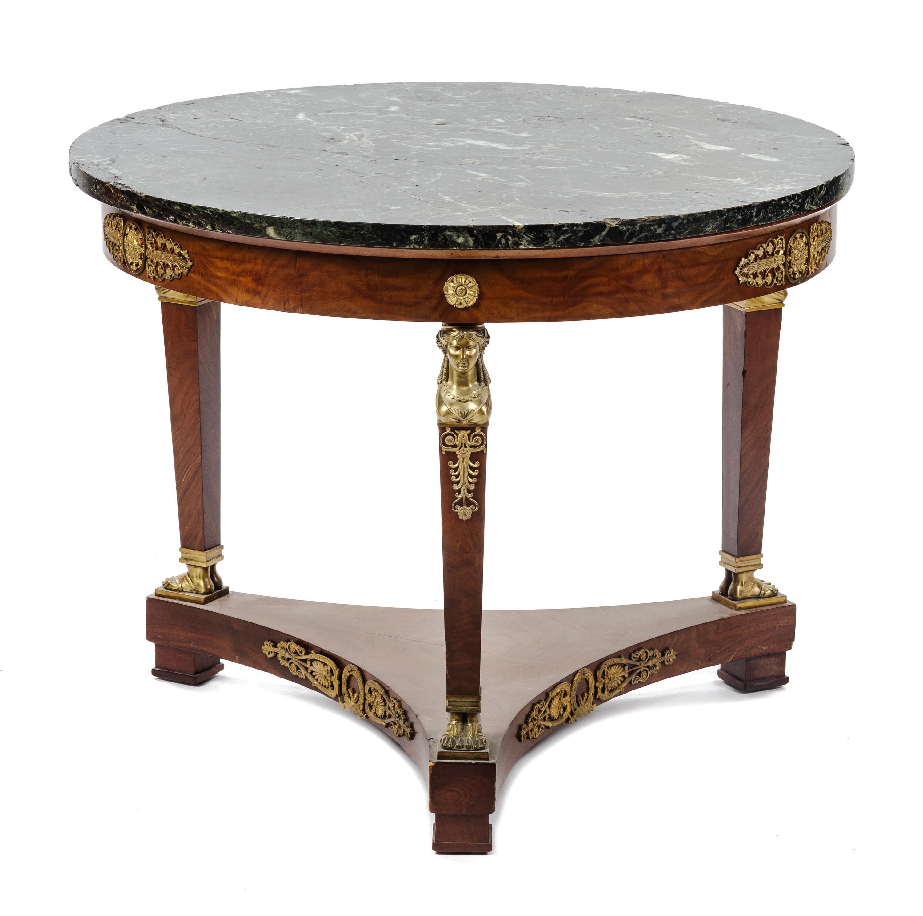 An Empire Style Gilt Bronze Mounted Walnut Gueridon, Height 28 x diameter 35 1/2 inches.