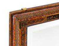 A Qajar Hand Carved and Lacquered Mirror